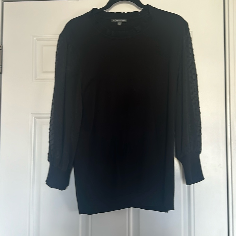 Black sweater with sheer polka dot sleeves
